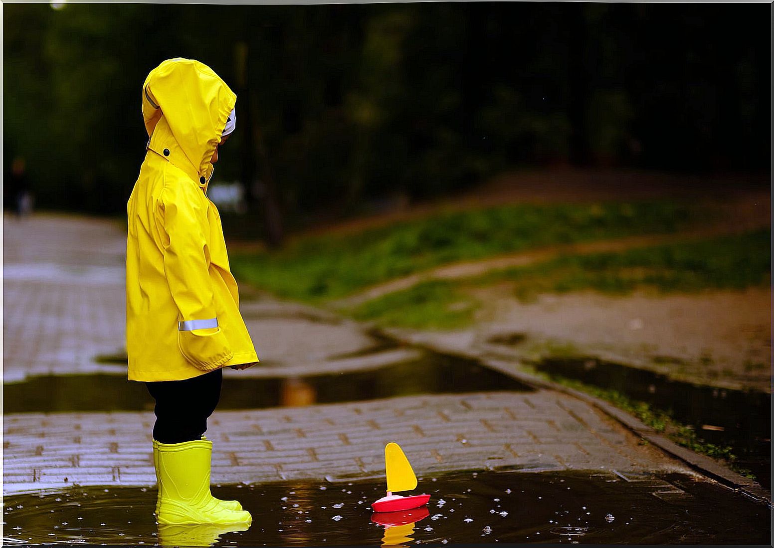 Children who feel alone playing in the rain.