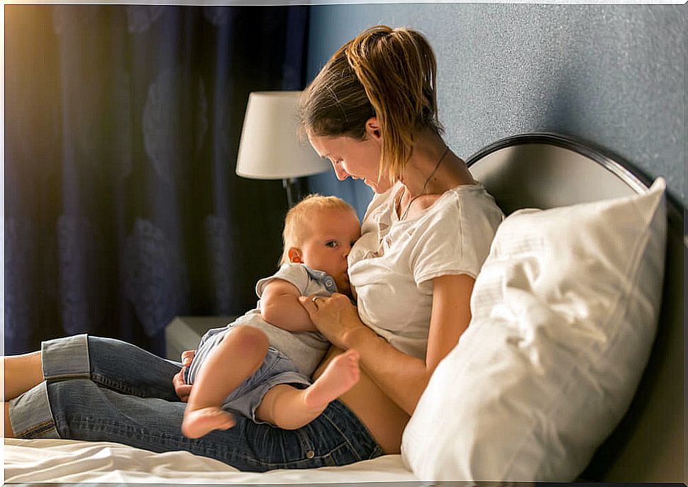 Mom breastfeeding her baby because of the enzymes in breast milk.