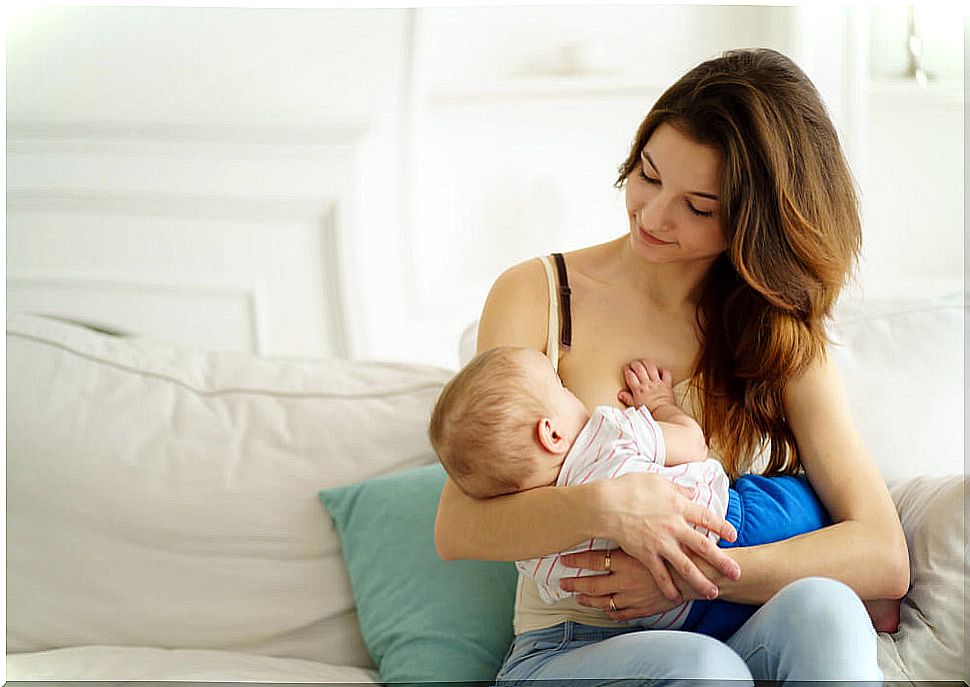 Mom breastfeeding her baby for the enzyme content of breast milk.