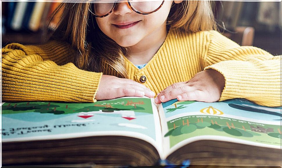 Girl reading a book from the Small and Large Collection.