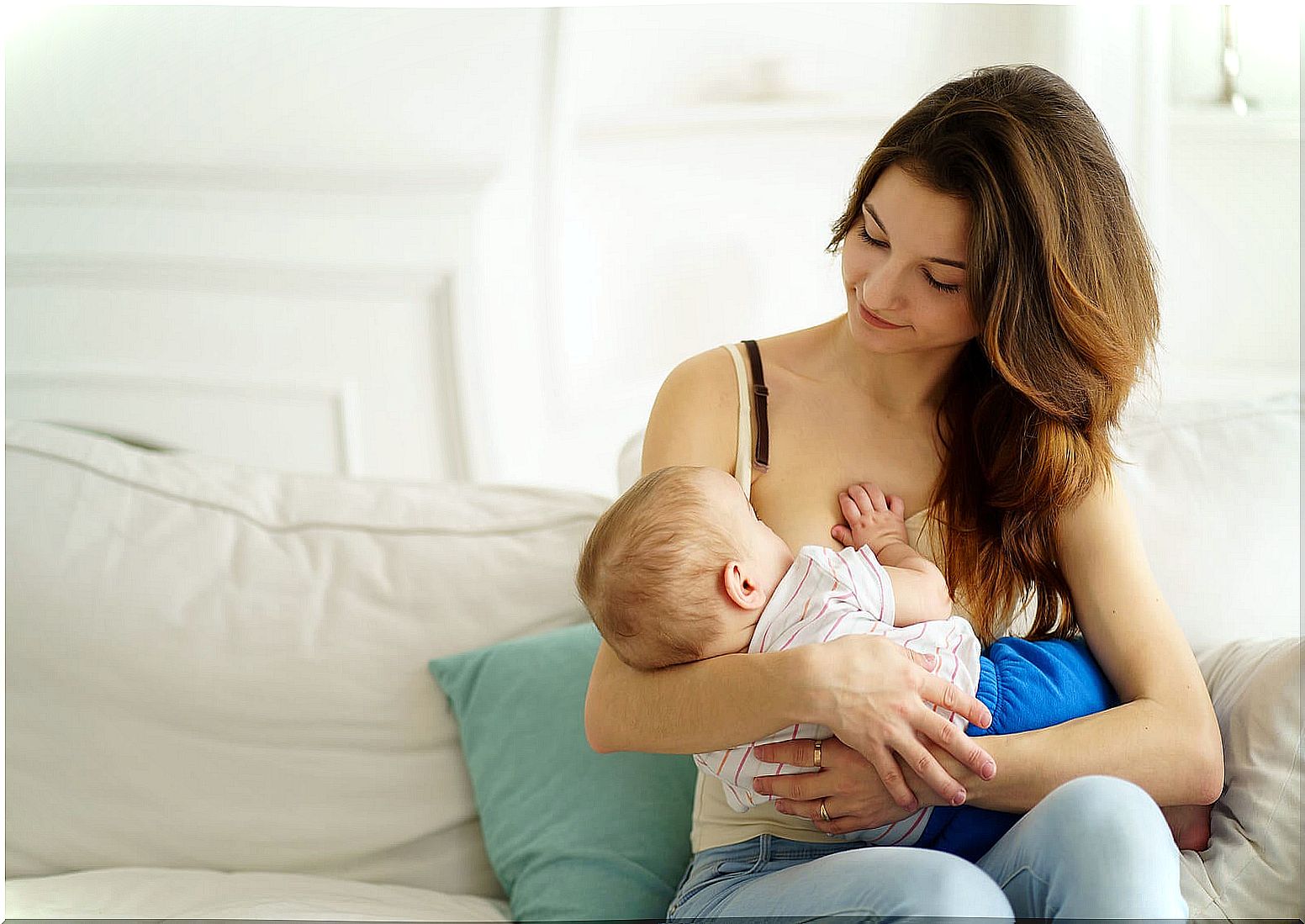 Mom with her baby following some breastfeeding tips.