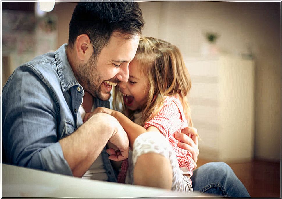 Father playing with his daughter during confinement.