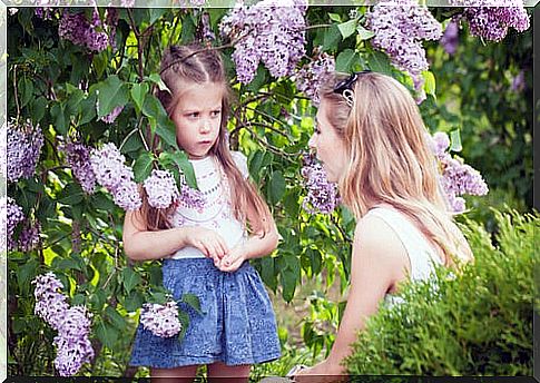 Mother talking with her daughter to set healthy boundaries.