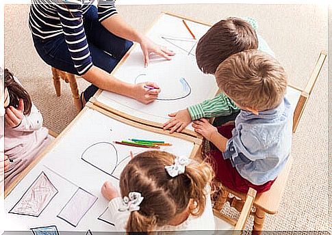 Teacher helping her students with dyslexia.