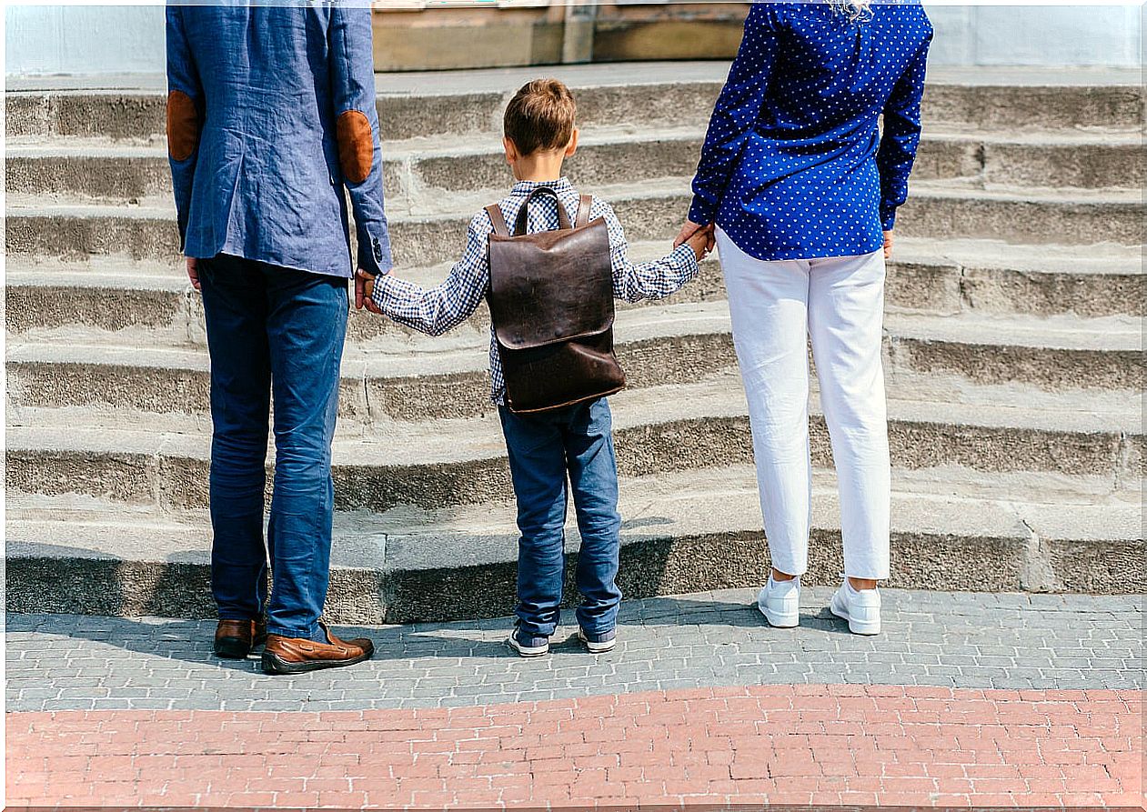 Parents accompanying their child to school.