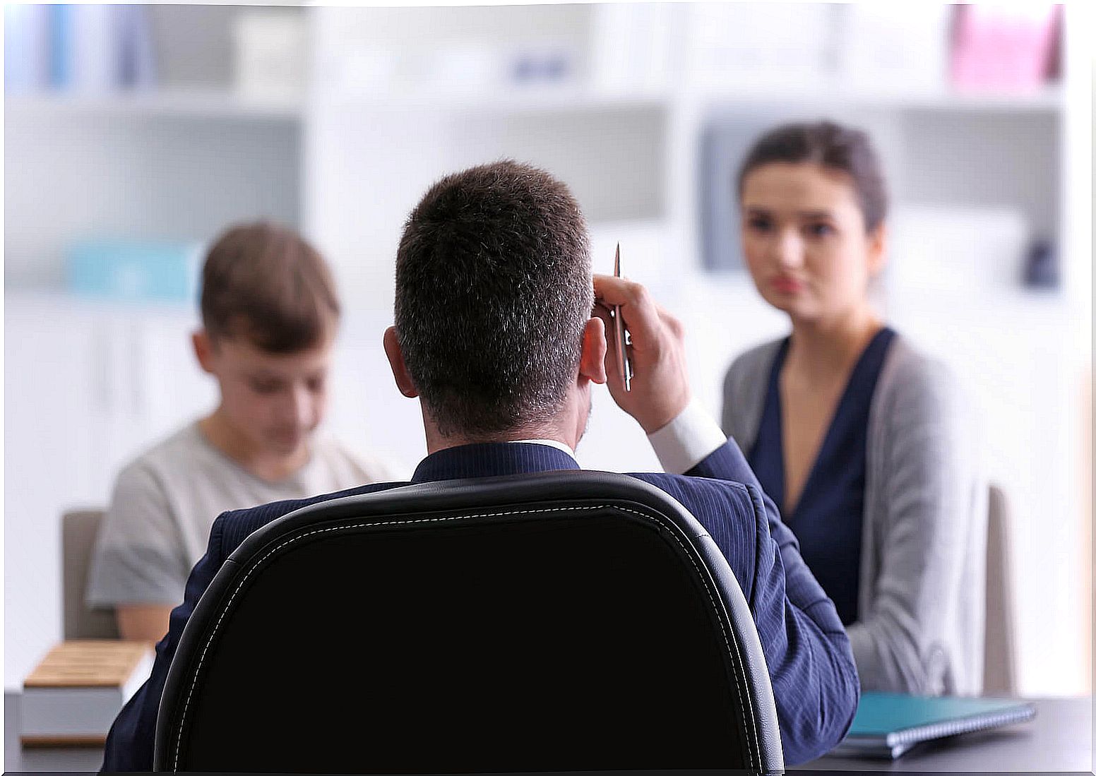 Mother in a meeting with her son's teacher to form a team between family and school.