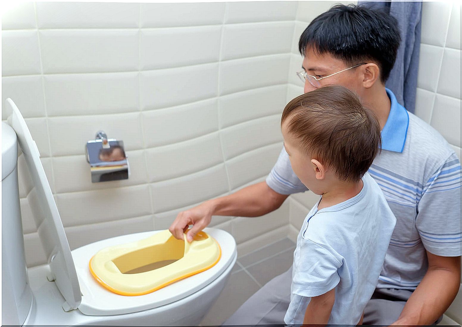 Father teaching his son to use the bathroom, because a father is not a babysitter.