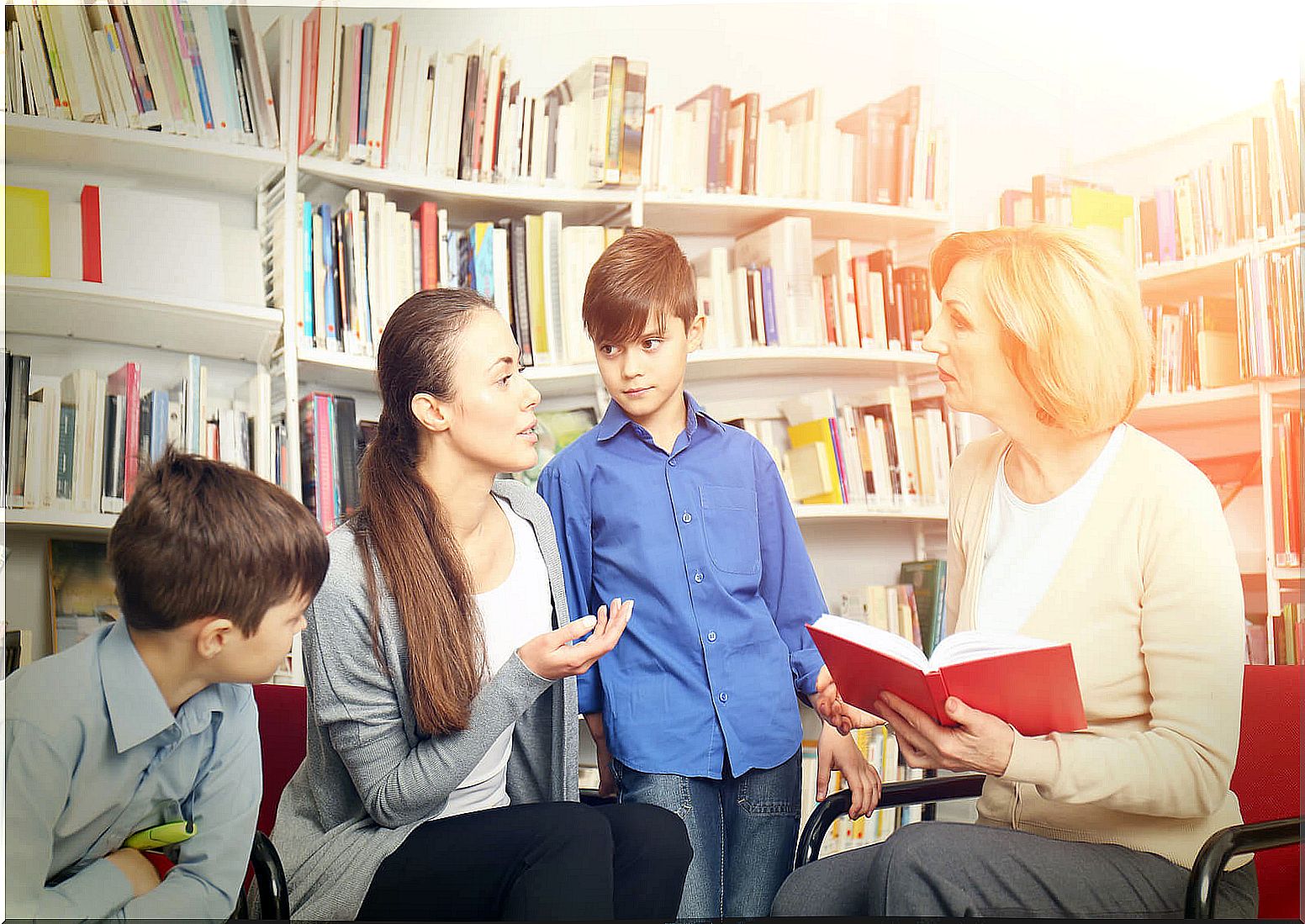 Hypertutor with students in the school library.