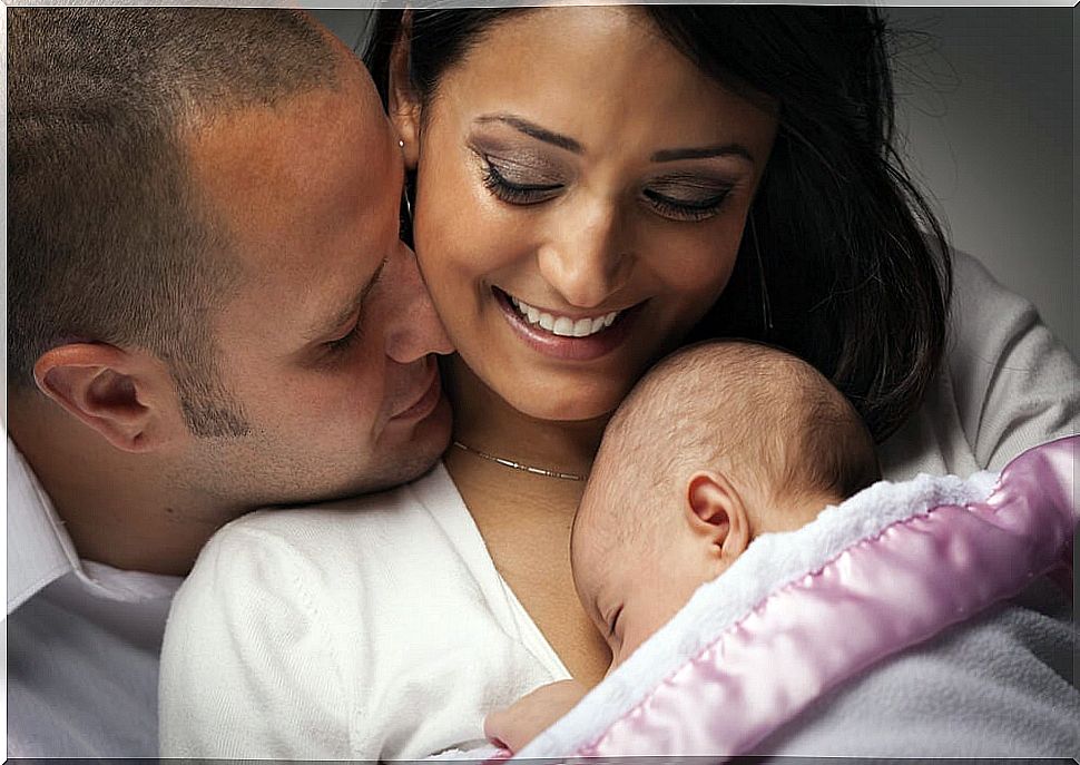 Parents with their newborn baby.