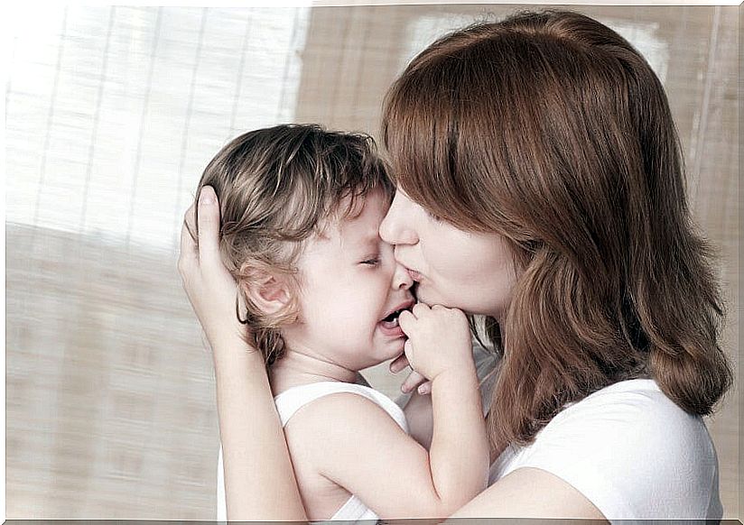 mom comforting son