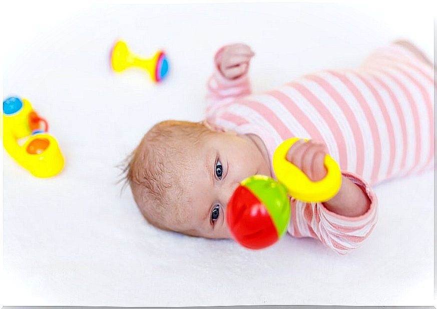 Functional newborn toys should have contrasting colors and sounds like bells or pleasant melodies.